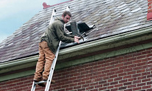 Worker fixing Gutter Worker fixing Gutter